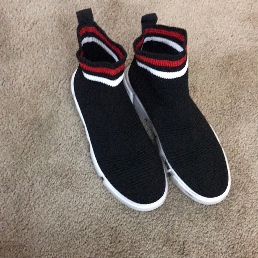 Black sock shoe with white a red lines